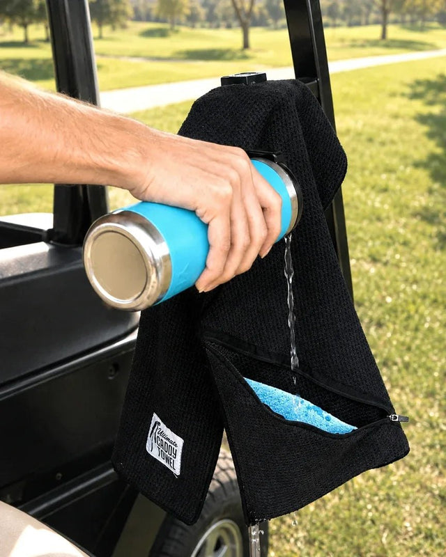Pouring water into the towel's sponge pocket on a golf cart