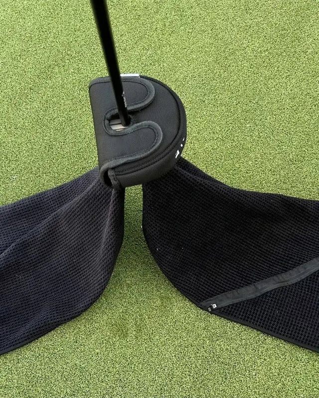 The towel covering a putter head